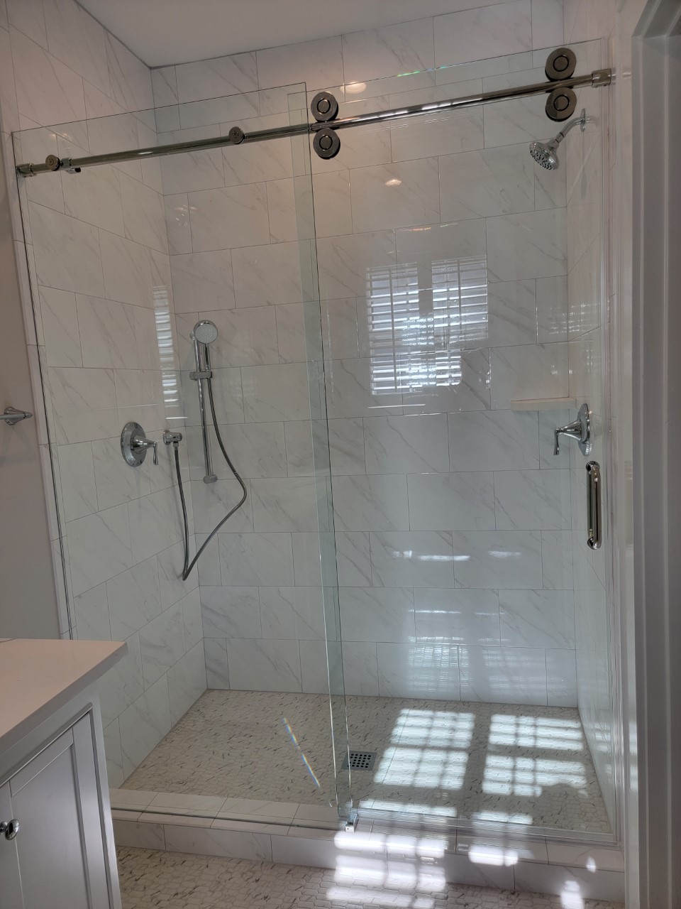 Glass Shower Area With White Tiles